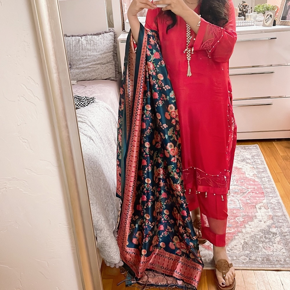 Hot pink shirt and trouser with printed silk dupatta.